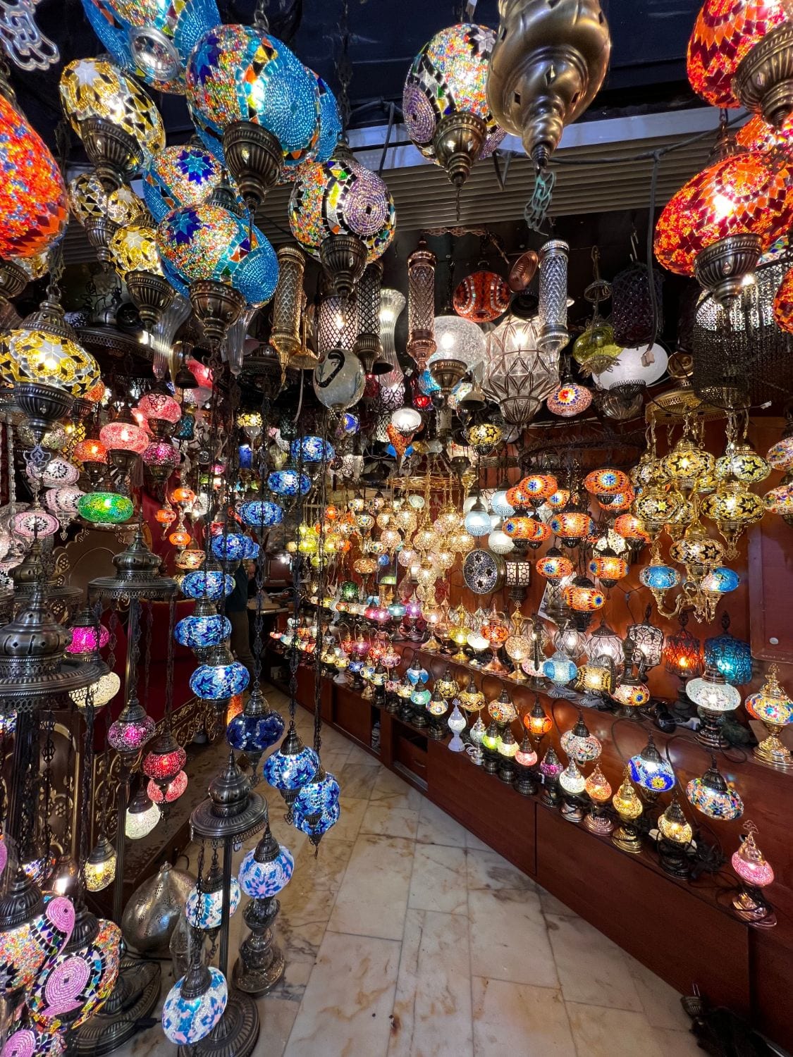 A Grand Bazaar shop glowing with hundreds of colourful Turkish mosaic lamps