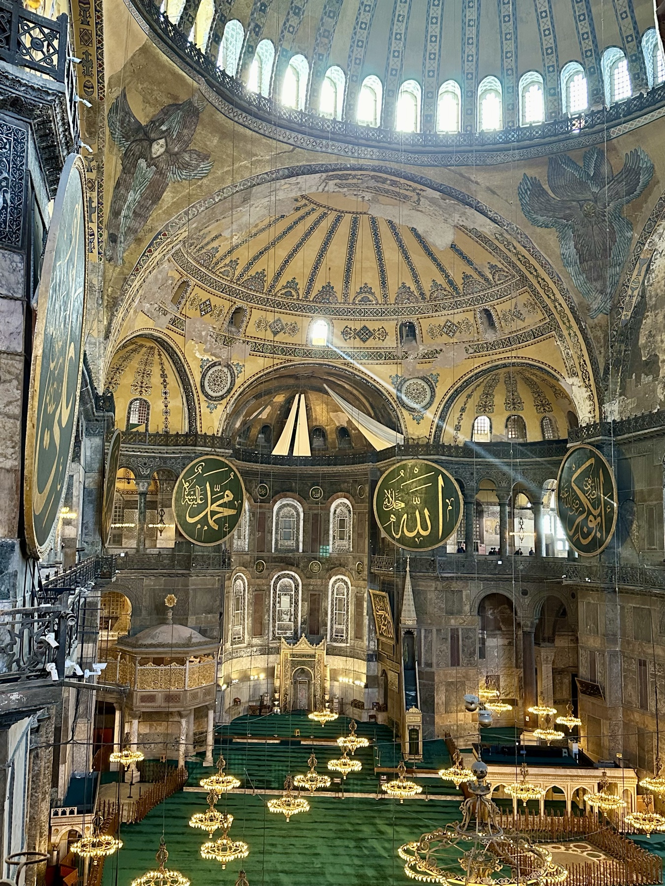 The soaring interior of Hagia Sophia, its great dome ringed with windows, six-winged seraphim mosaics and vast Ottoman calligraphic roundels