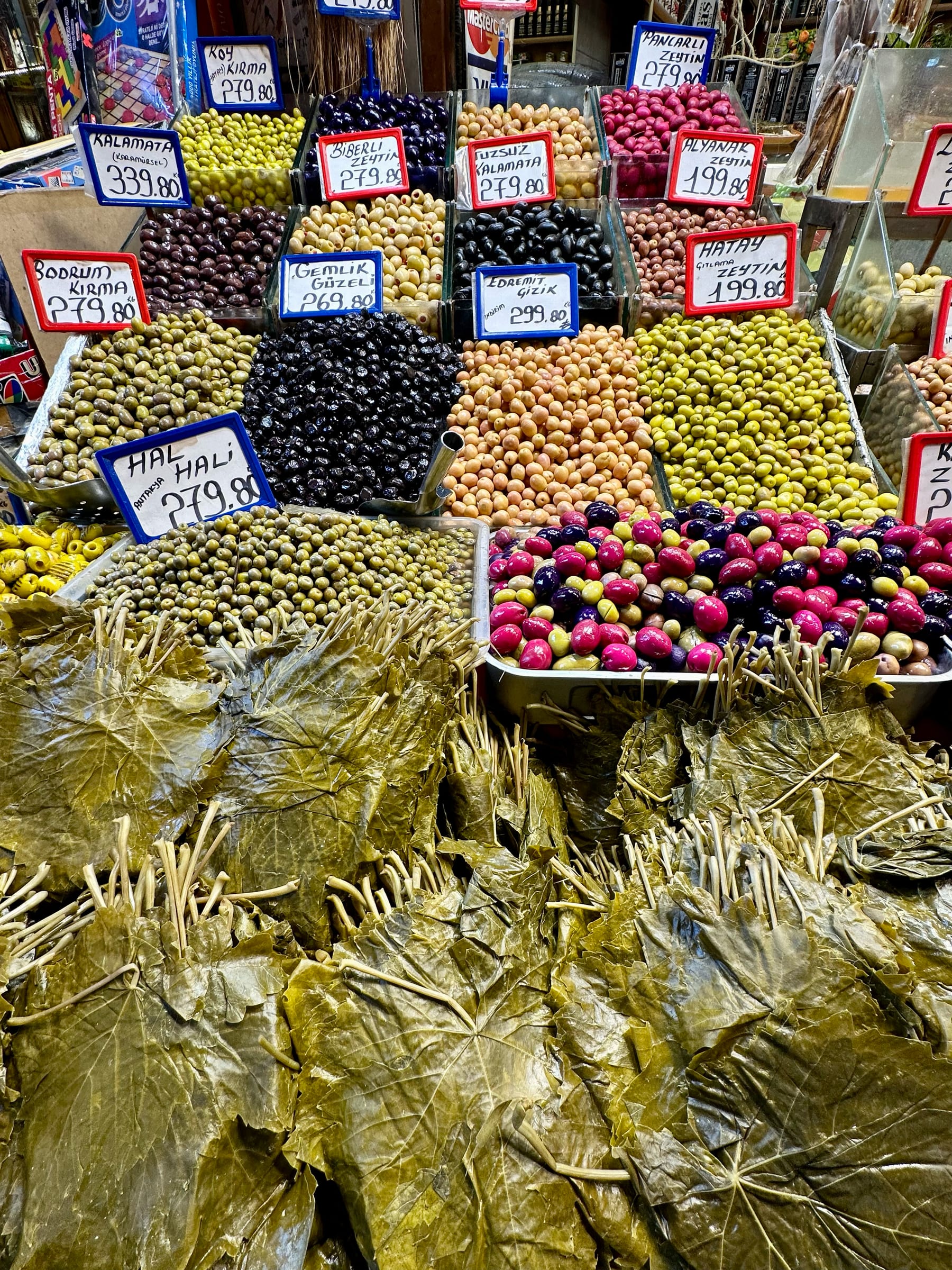 A market display of olives and stuffed vine leaves in Istanbul