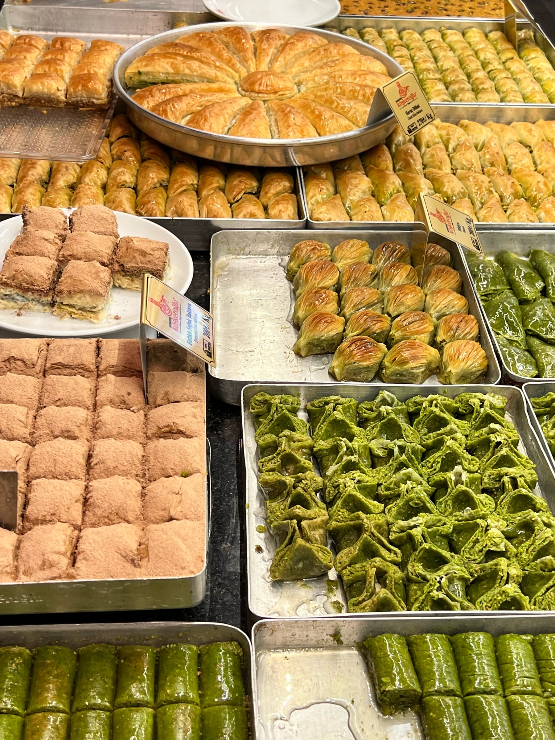 Trays of fresh pistachio and walnut baklava in an Istanbul sweet shop