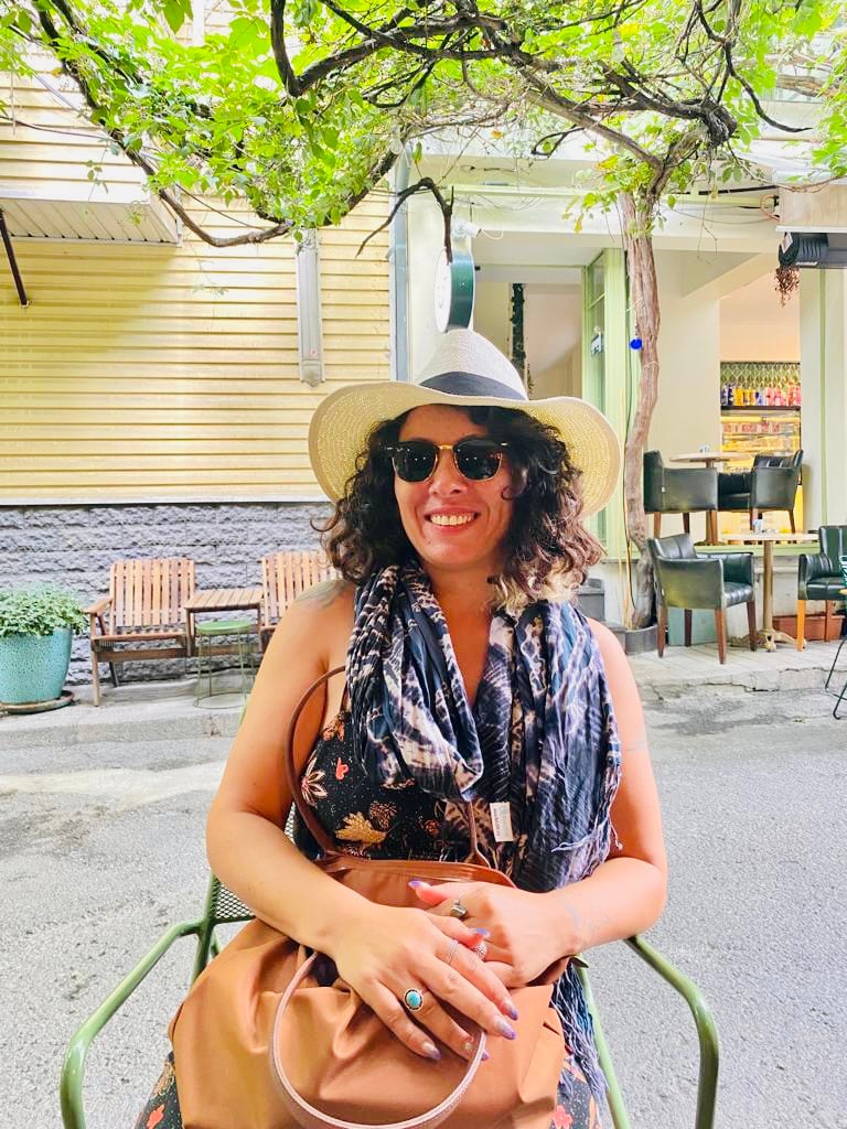 Derya, a tour guide at Off The Beaten Path Istanbul, at a leafy Istanbul cafe
