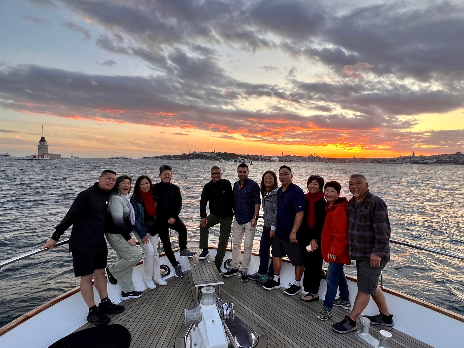 Furkan, lead guide, with guests on a private Bosphorus sunset cruise in Istanbul